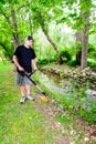 Man Using Weed Trimmer Smiling Royalty Free Stock Photo