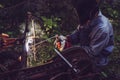 Man using welding machine stick to cut melt iron metal construction outdoors. Royalty Free Stock Photo