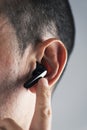 Man using wireless earphones Royalty Free Stock Photo