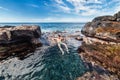 Man on vacation on tropical island relaxin on natural ocean bath