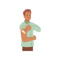 Man after vaccination showing plaster on shoulder