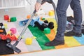 Man vacuuming child`s room