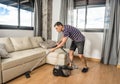 Man vacuuming the living room floor Royalty Free Stock Photo