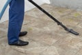 the man vacuums the tile after laying. preparation for jointing