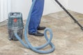 the man vacuums the tile after laying. preparation for jointing