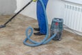 the man vacuums the tile after laying. preparation for jointing