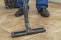 the man vacuums the tile after laying. preparation for jointing