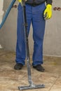 the man vacuums the tile after laying. preparation for jointing