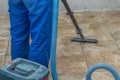 the man vacuums the tile after laying. preparation for jointing