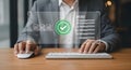 man verifying documents with a digital checkmark Royalty Free Stock Photo