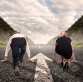 Man versus woman on a road Royalty Free Stock Photo