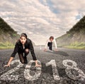 Man versus woman on a road. Year 2018 concept Royalty Free Stock Photo