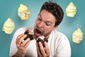 Man is very hungry and eats a lot of cupcake Royalty Free Stock Photo