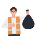 Man in a vest holding a black plastic bin bag Royalty Free Stock Photo