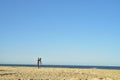 Man with video camera on tripod in beach coast landscape Baja, Mexico