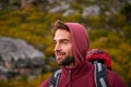 Man, view and thinking with travel and hiking for fitness, fresh air and backpacking with smile outdoor. Calm, peace and Royalty Free Stock Photo