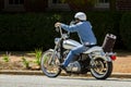 A man on a vintage motorbike