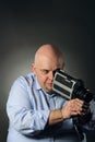 Man with vintage videocamera Royalty Free Stock Photo