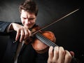 Man violinist playing violin. Classical music art