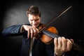 Man violinist playing violin. Classical music art Royalty Free Stock Photo