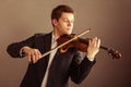 Man violinist playing violin. Classical music art Royalty Free Stock Photo