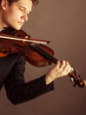 Man violinist playing violin. Classical music art Royalty Free Stock Photo