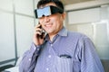 Man in virtual reality glasses talking on phone