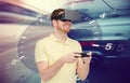 Man in virtual reality headset and car racing game Royalty Free Stock Photo