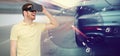 Man in virtual reality headset and car racing game Royalty Free Stock Photo