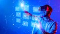 Man in Virtual Reality Headset Engaging with Interactive Digital Interface, Exploring Futuristic Technology and Social Royalty Free Stock Photo
