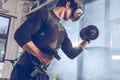 Man in virtual reality headset exercising with dumbbells in gym Royalty Free Stock Photo