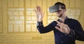 Man in virtual reality headset hands out against yellow hand drawn windows Royalty Free Stock Photo
