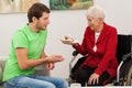 Man visiting his disabled aunt Royalty Free Stock Photo