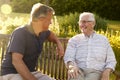 Man Visiting Senior Male Relative In Assisted Living Facility Royalty Free Stock Photo
