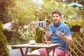 Man vlogger using smart phone while recording video for feed vlog, Digital nomad sharing content online while traveling