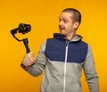 Man vlogger or videographer filming self using camera on gimbal Royalty Free Stock Photo