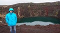 Man and volcano crater hole in Iceland