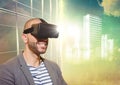 Man in VR with flares and white building graphic against window and evening sky Royalty Free Stock Photo