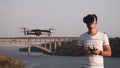 Man in VR glasses controlling drone