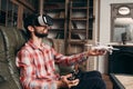 Man in vr glasses launching drone indoors