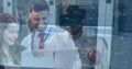 Man with VR headset interacting with holographic code overlays in data center, with server racks Royalty Free Stock Photo