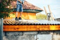 man wach clean carpet outdoor on roof with water Royalty Free Stock Photo