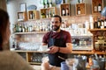 Man or waiter serving customer at coffee shop Royalty Free Stock Photo