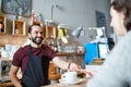 Man or waiter serving customer at coffee shop Royalty Free Stock Photo