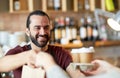 Man or waiter serving customer at coffee shop Royalty Free Stock Photo