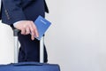 Man with passport and suitcase in his hands. Royalty Free Stock Photo