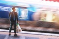 A man waiting for the blurry train under the light leak at station in Melbourne, Australia