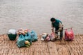 Man Waiting Boat for Moving Commodities in The River at Luang Prabang, Laos Royalty Free Stock Photo