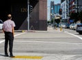 Man waiting in a corner of one of Los Angeles Downtown streets