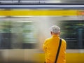 Man waiting train on platform Tokyo Japan city lifestyle
